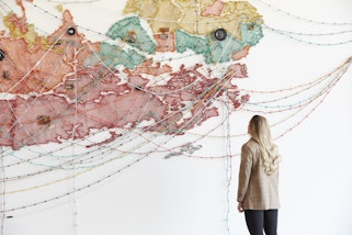 Installation view of the Making Worlds exhibition in the new building at the Art Gallery of New South Wales, featuring Reena Saini Kallat Woven chronicle 2018 © Reena Saini Kallat, photo: Zan Wimberley