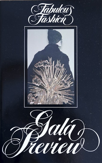 A publication cover with the words Fabulous Fashion Gala Preview and a photo of a person wearing an ornate cloak