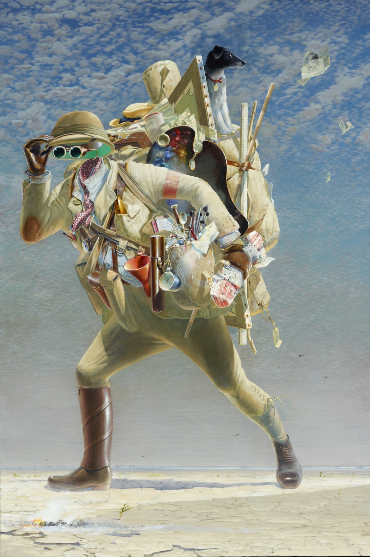 A faceless person carrying many items striding across a desert landscape