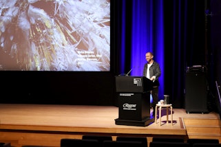 Anthony Burke presenting a lecture as part of the 'Encountering art in extraordinary places' series at the Art Gallery of New South Wales