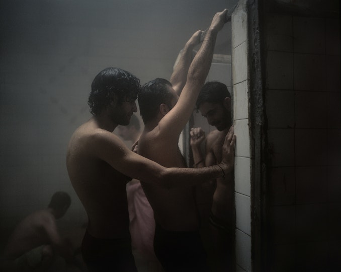 Unclothed people in a shower area