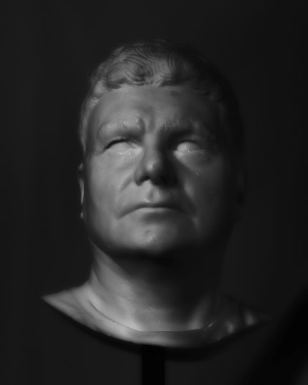 The head and neck bust of a short-haired person with blank eyes