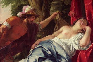 A person looks at someone sleeping