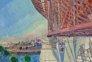 A partial view of a bridge and an urban harbour setting