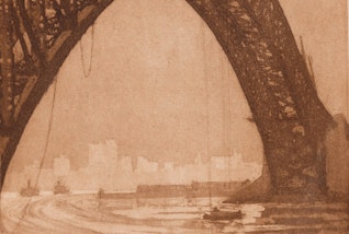 A bridge curves over boats on a harbour with a city skyline in the background