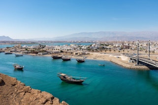 Traditional wooden dhow boats in Sur, Oman 