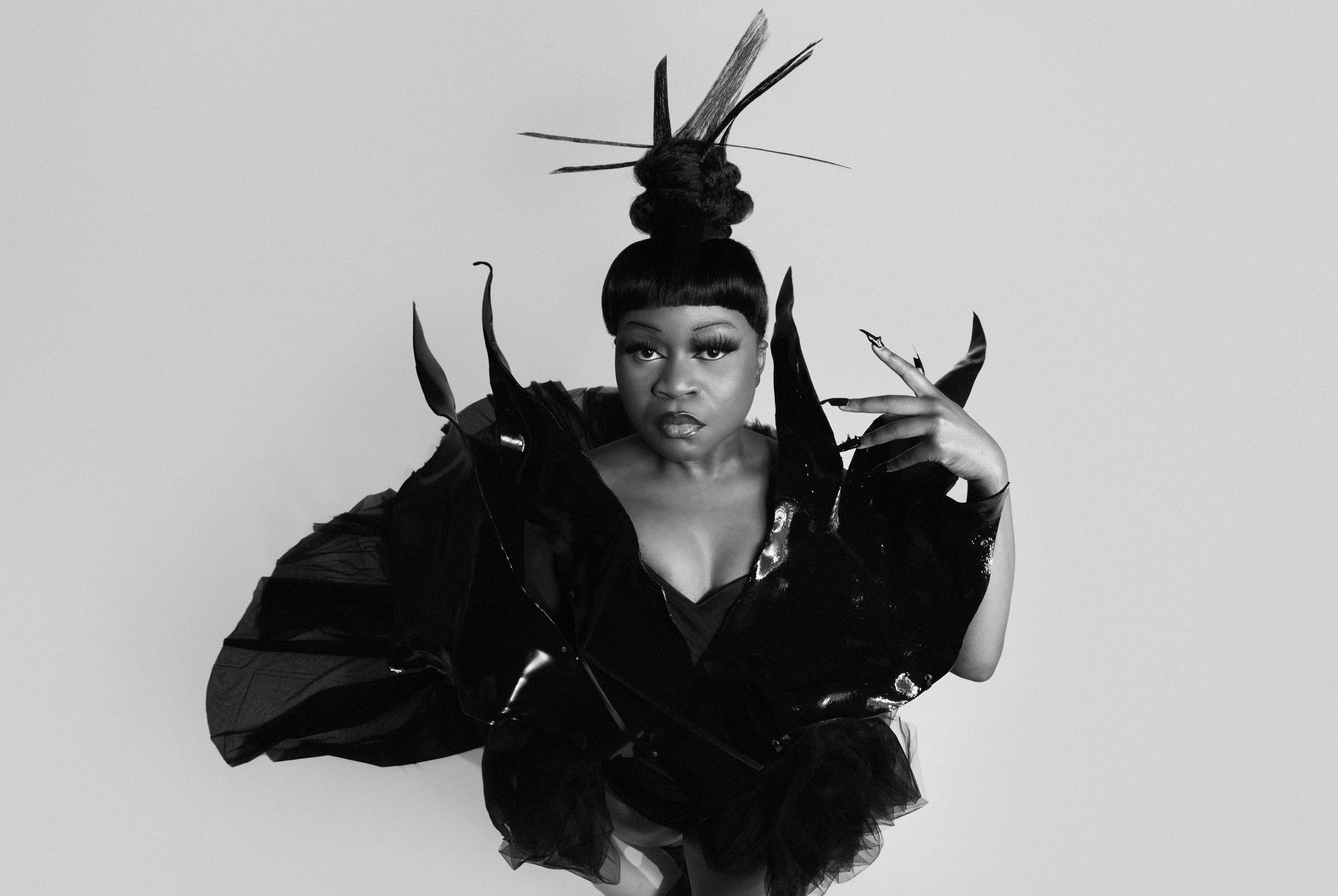 A person in an embellished costume and headwear