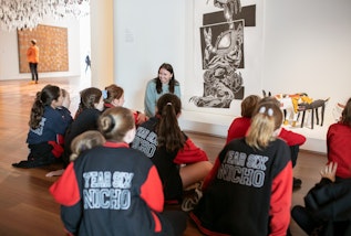 Art Gallery educator speaking with students at the Art Gallery of New South Wales.