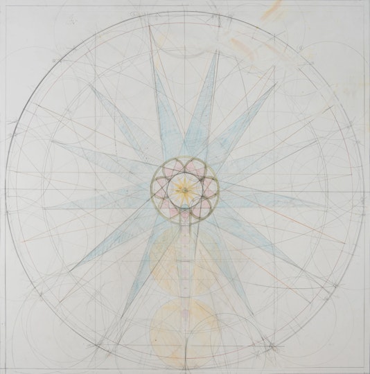 A pencil drawing of a circle in which there are ruled lines, a small central flower-like shape and a large star-like shape.