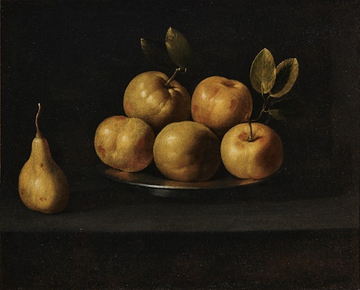 Five apples on a pewter plate and a pear sitting alongside against a very dark background