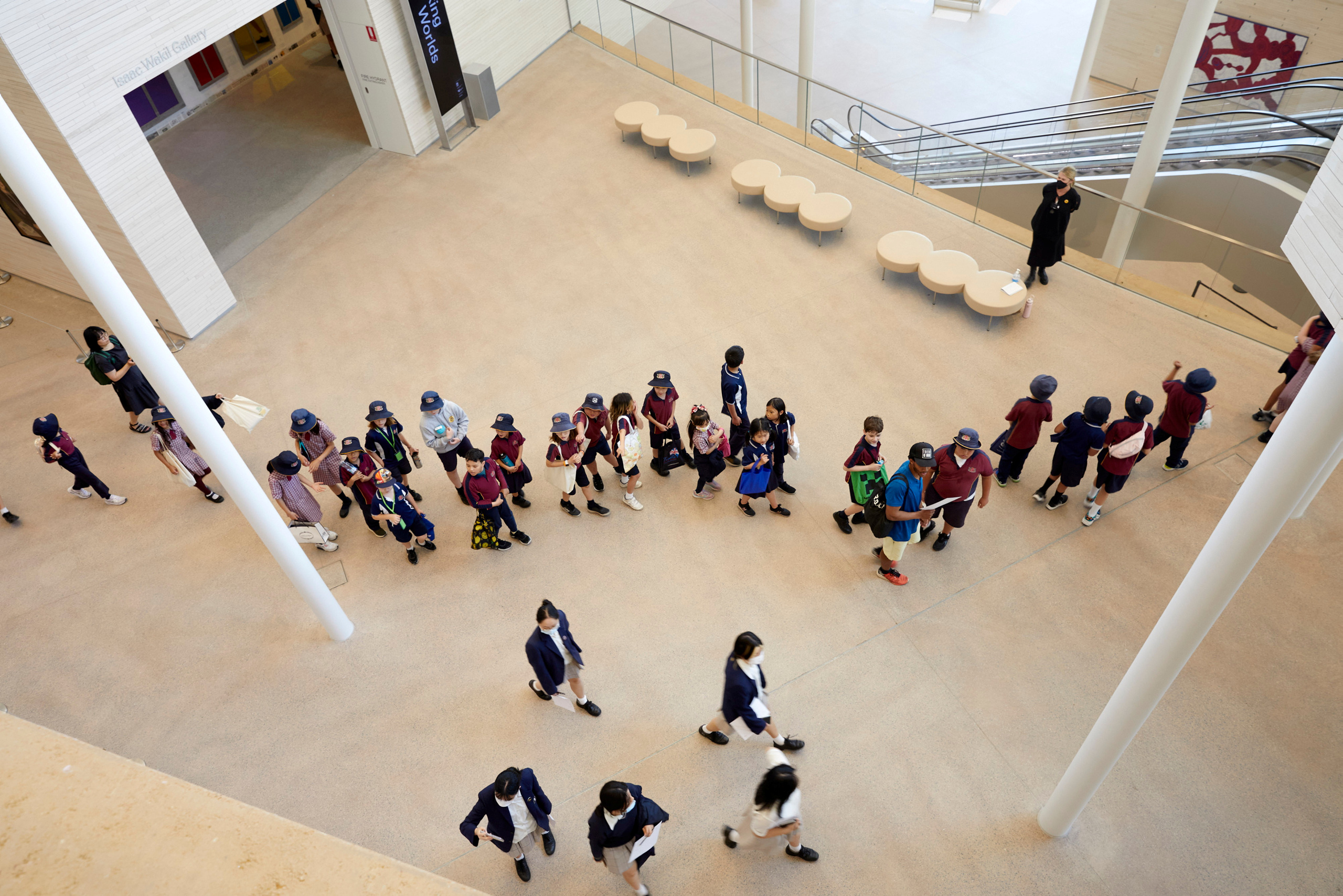 Aerial view of a group of students walking through an atrium