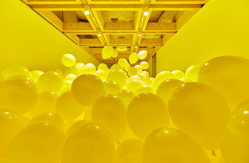 Art installation featuring yellow balloons