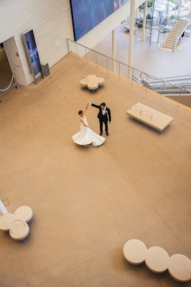 A man and a woman dancing inside a building