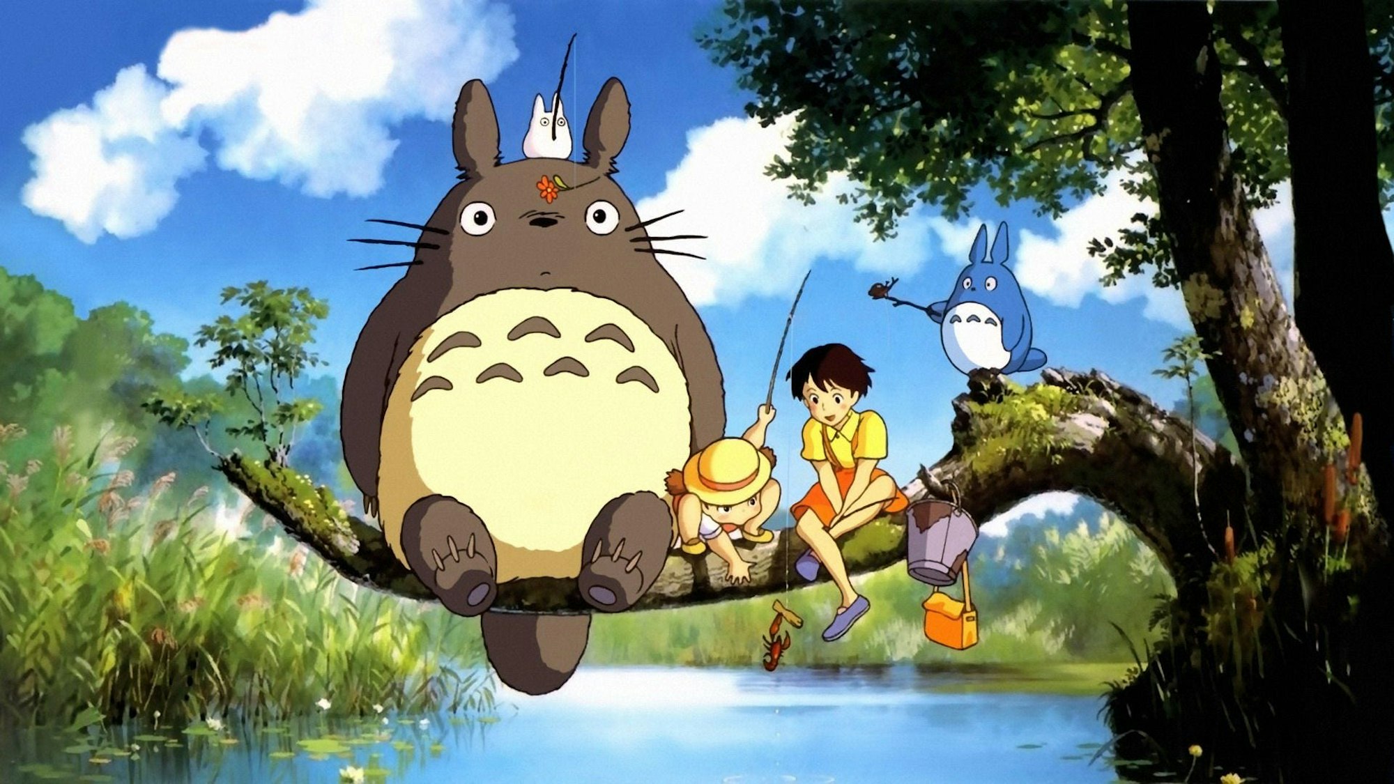 A cat-like creature and two girls fish in a stream from an overhanging tree branch.