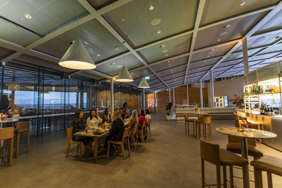 A group of people at a table in a modern restaurant