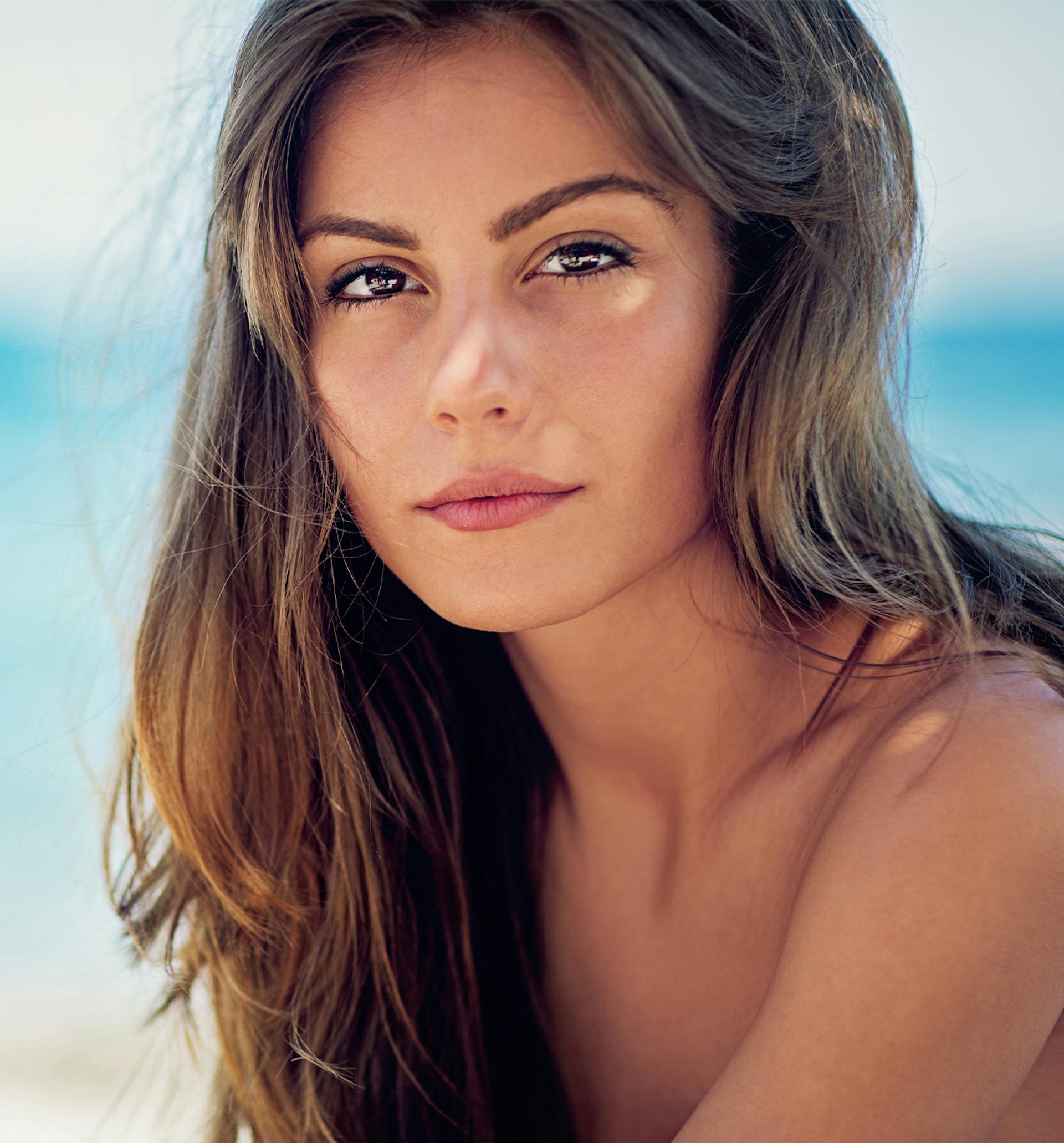 Woman with brown hair at the beach