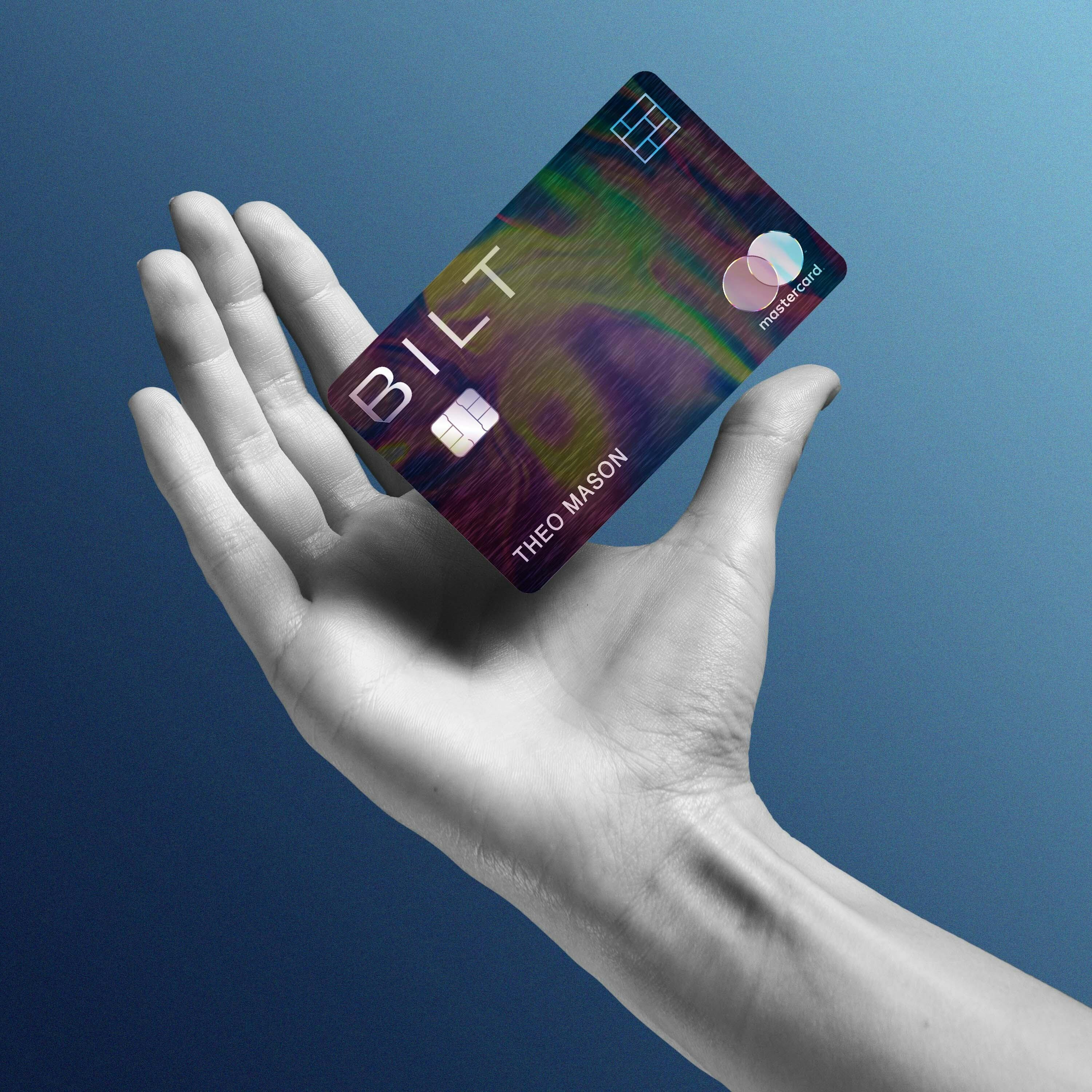 hand holding card with a gradient background