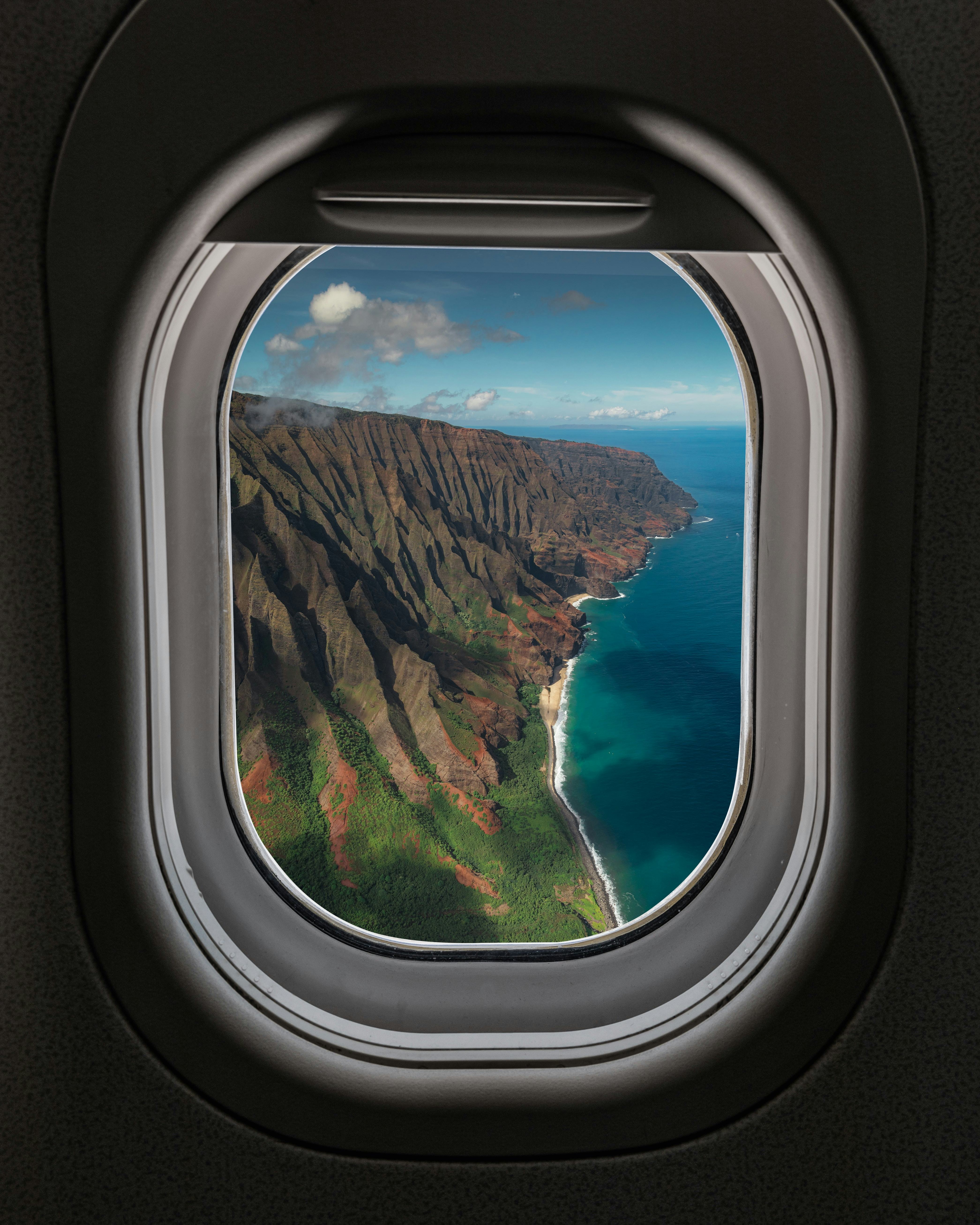 View of Hawaiian island through airplane window