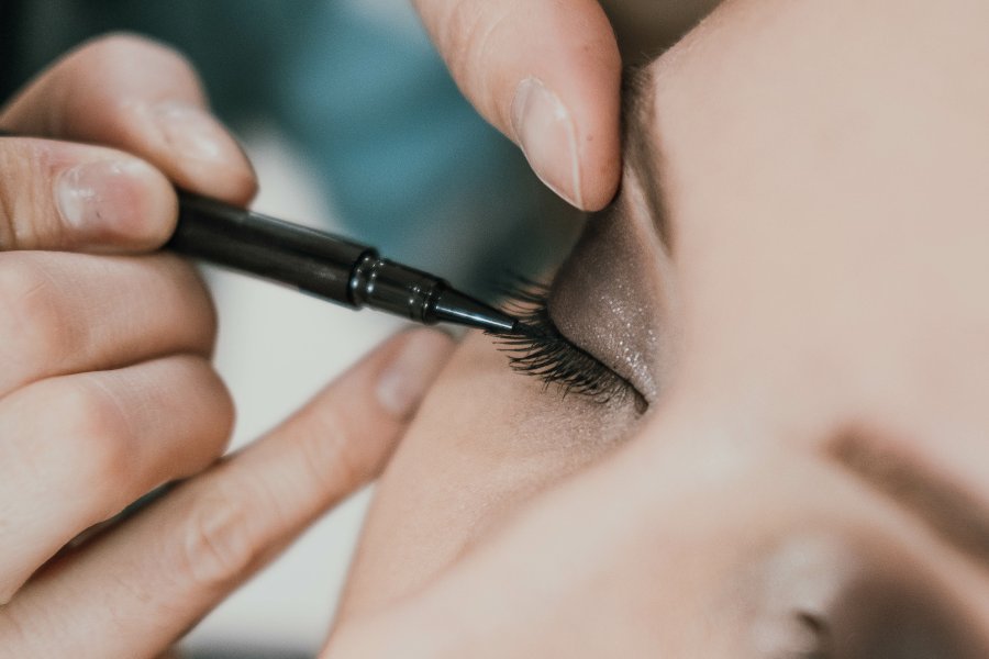 Make-up artist applying eye make-up