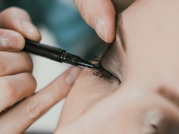 Make-up artist applying eye make-up