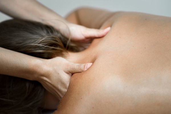 Female client in Edinburgh receiving a deep tissue massage