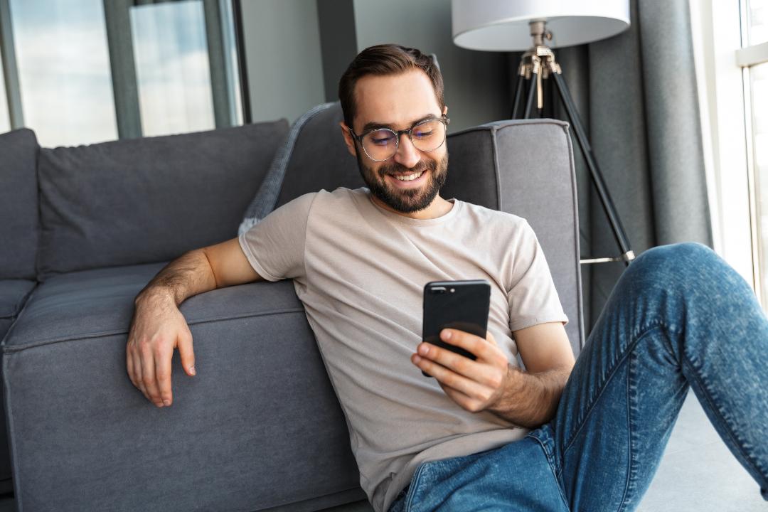Man booking barber on mobile