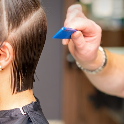 Mobile hairdresser cutting ladies hair