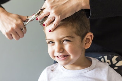 Boy getting his hair cut