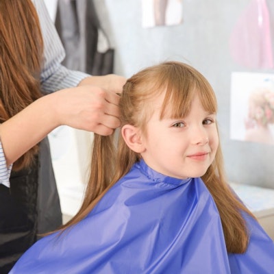 Girl getting her hair styled