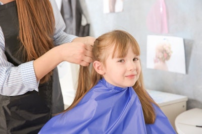 Girl getting her hair styled