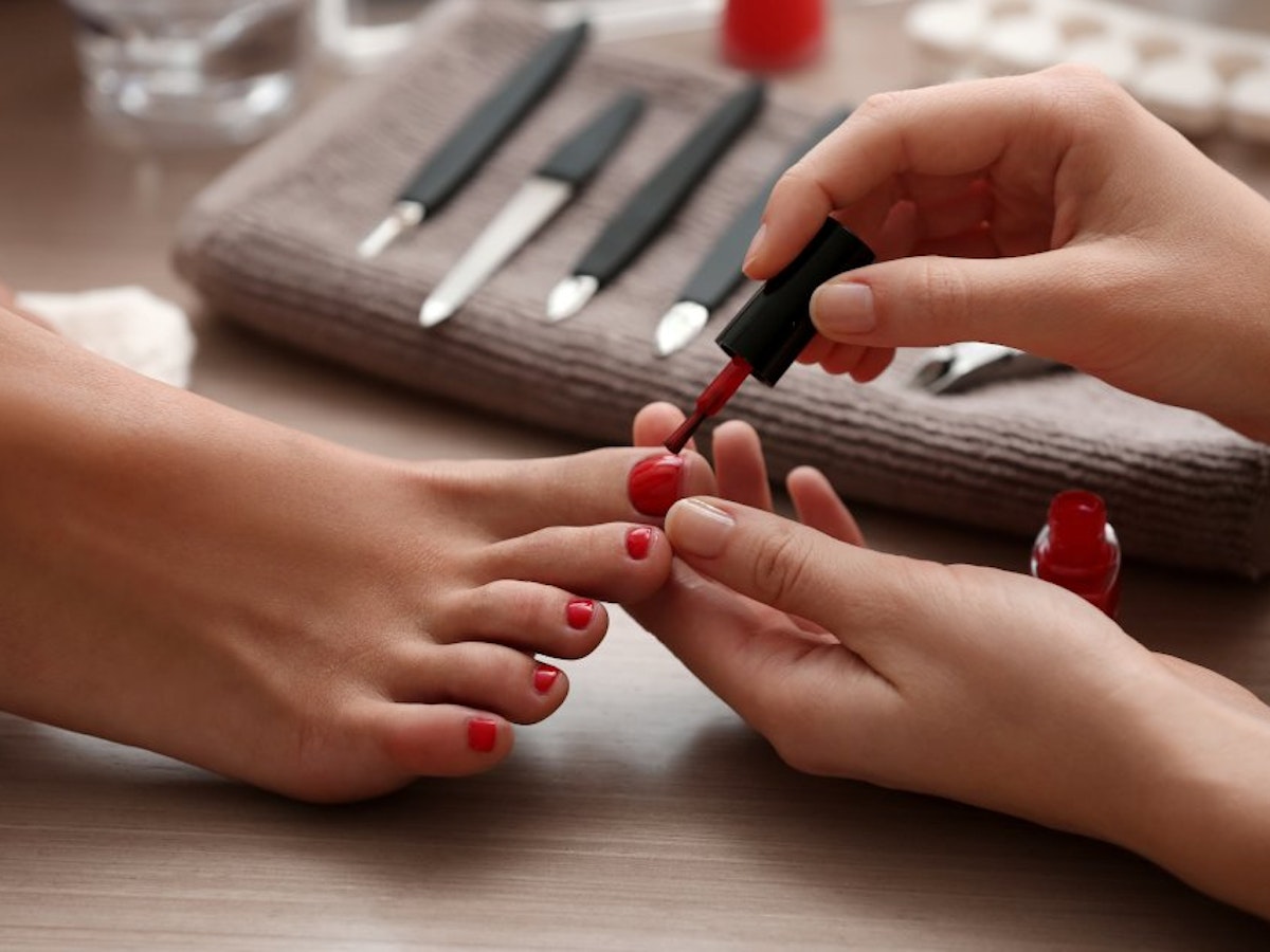 Woman receiving a pedicure at home