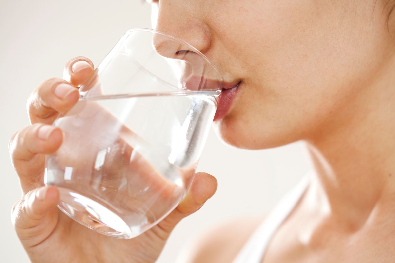 Woman drinking water after a massage
