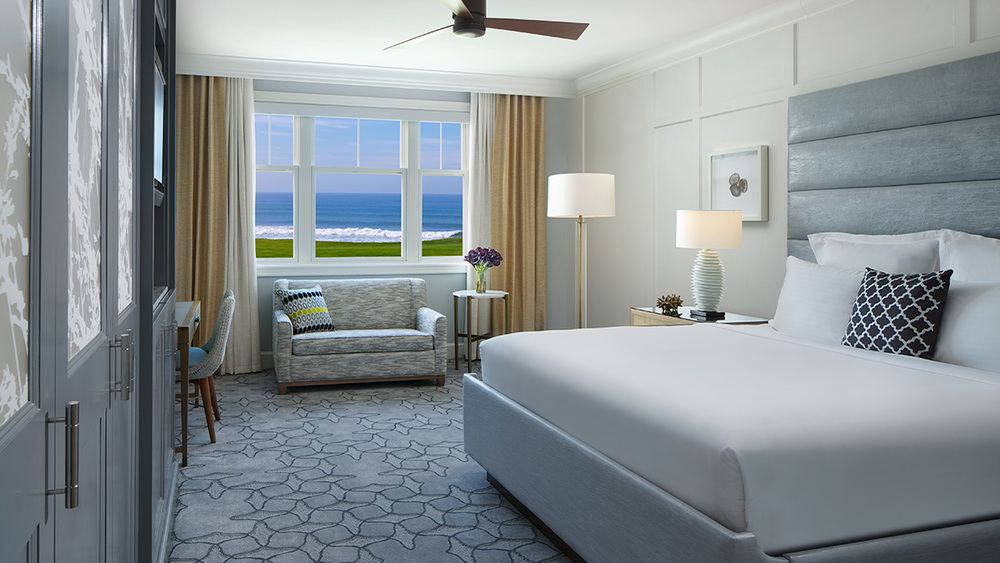 Ritz Carlton Hotel of spacious bedroom and the sight of crashing waves our the window