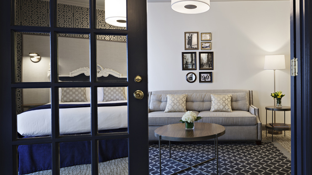 Warwick Hotel stylish bedroom suite with warm lighting