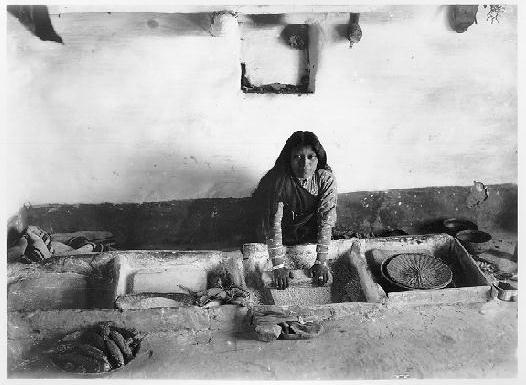 Young woman in the process of grinding corn. Hopi. 1901. 
Credit Information: © The Field Museum
ID# CSA250Photographer: Charles Carpenter