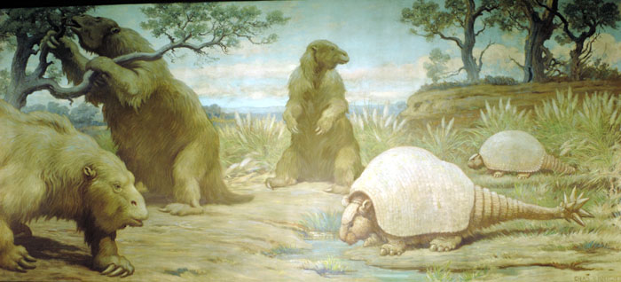 A Charles Knight mural depicting three ground sloths and two glyptodonts as they forage for food and water.