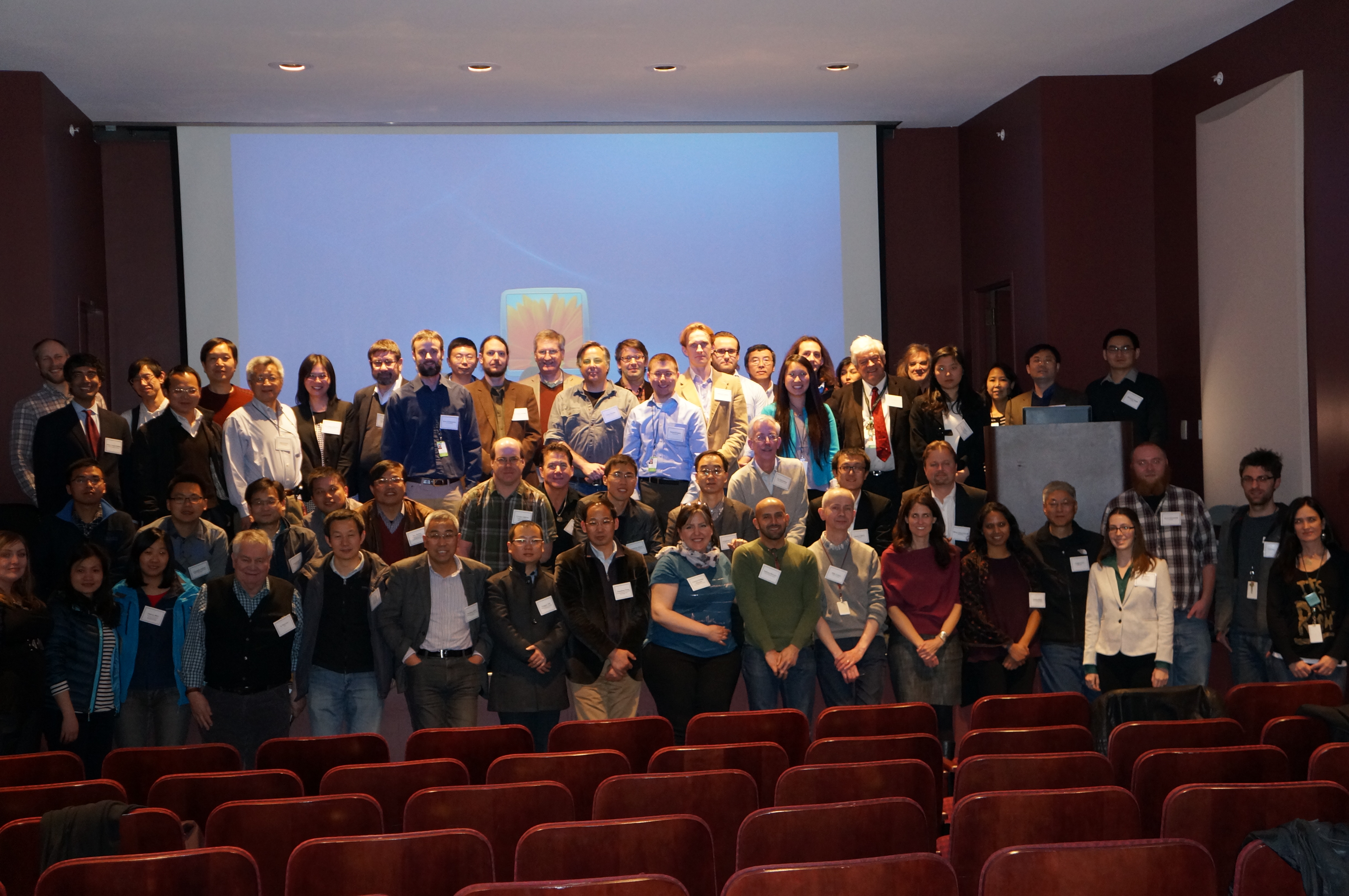 Group of participants in 2015 Critical Transitions workshop gathered on stage