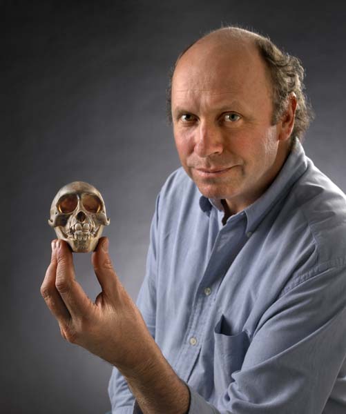 Bill and the skull of Rungwecebus kipunji. 2006. Field Museum photo by John Weinstein. Z94441_43d