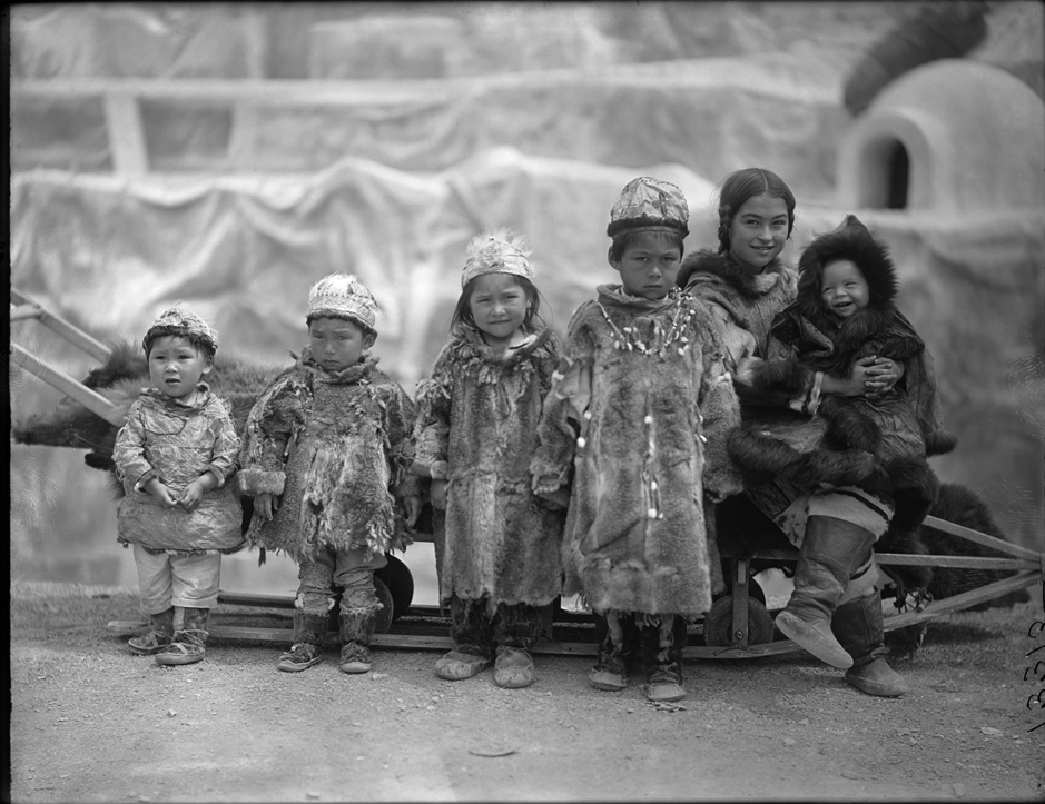 Eskimo children, including Nancy Columbia on far right, pose on a dog sled at the Louisiana Purchase Exposition (a/k/a St. Louis Fair) circa 1904.
© The Field Museum, ID# CSA13315. Photo by Charles Carpenter.