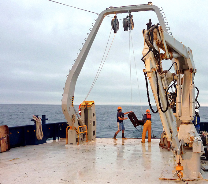 Chris Jones and the marine technician releasing the otter trawl.