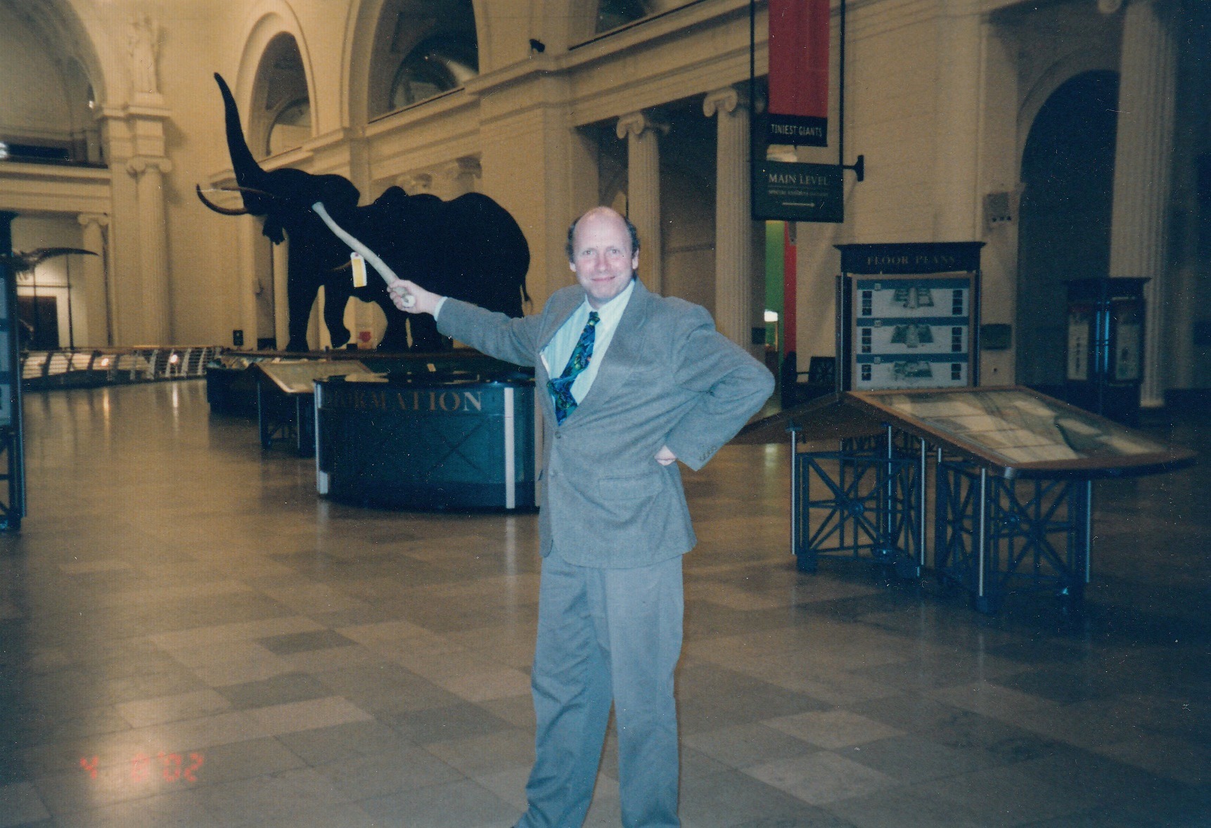 Bill and another of his favorite teaching tools, a walrus baculum (penis bone), in Stanley Field Hall, 2002. Courtesy of Kathy Ballard.