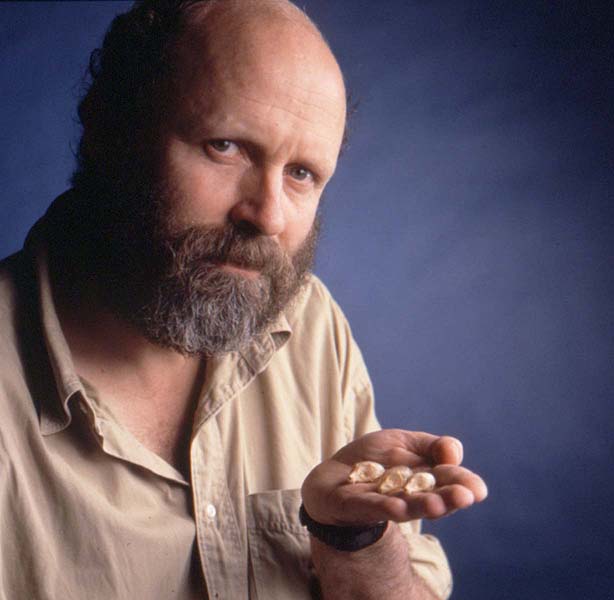 Bill holds the skulls of three mouse lemurs described as new to science in 2000 by a Field Museum-Malagasy team. Field Museum photo by Mark Widhalm. GN89937_9c.