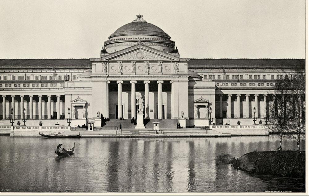 South facade of the Palace of Fine Arts building from the World's Columbian Exposition, Chicago, 1893. Gondola boats in the lagoon and people on stairs.