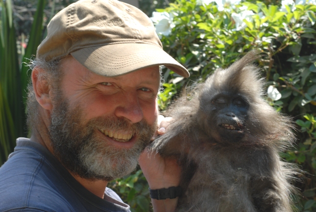 Bill and the type specimen of Rungwecebus kipunji, the new monkey genus he co-described in 2006. The specimen was trapped by a farmer in 2005. Courtesy of Tim Davenport.