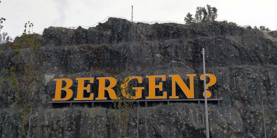 A rock face with the word Bergen? affixed to it