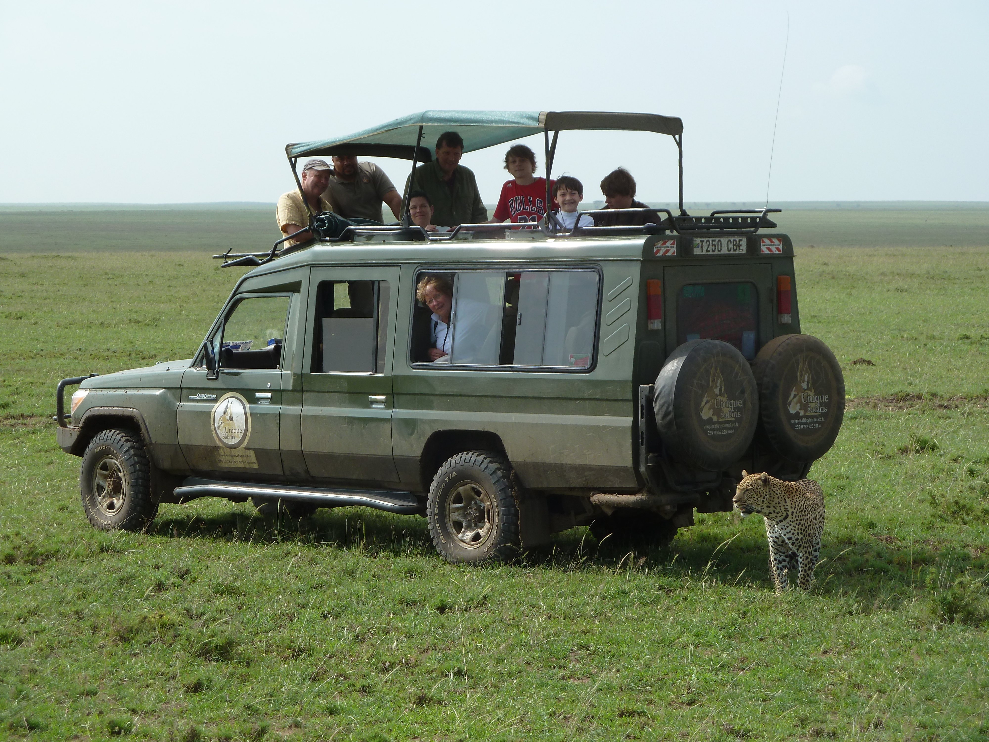 Leading a tour in Serengeti National Park, Tanzania in 2014. That’s Arnold Mushi of Unique Safaris next to Bill, and the Crawford family of Lake Forest. Courtesy of Mary Anne Rogers.