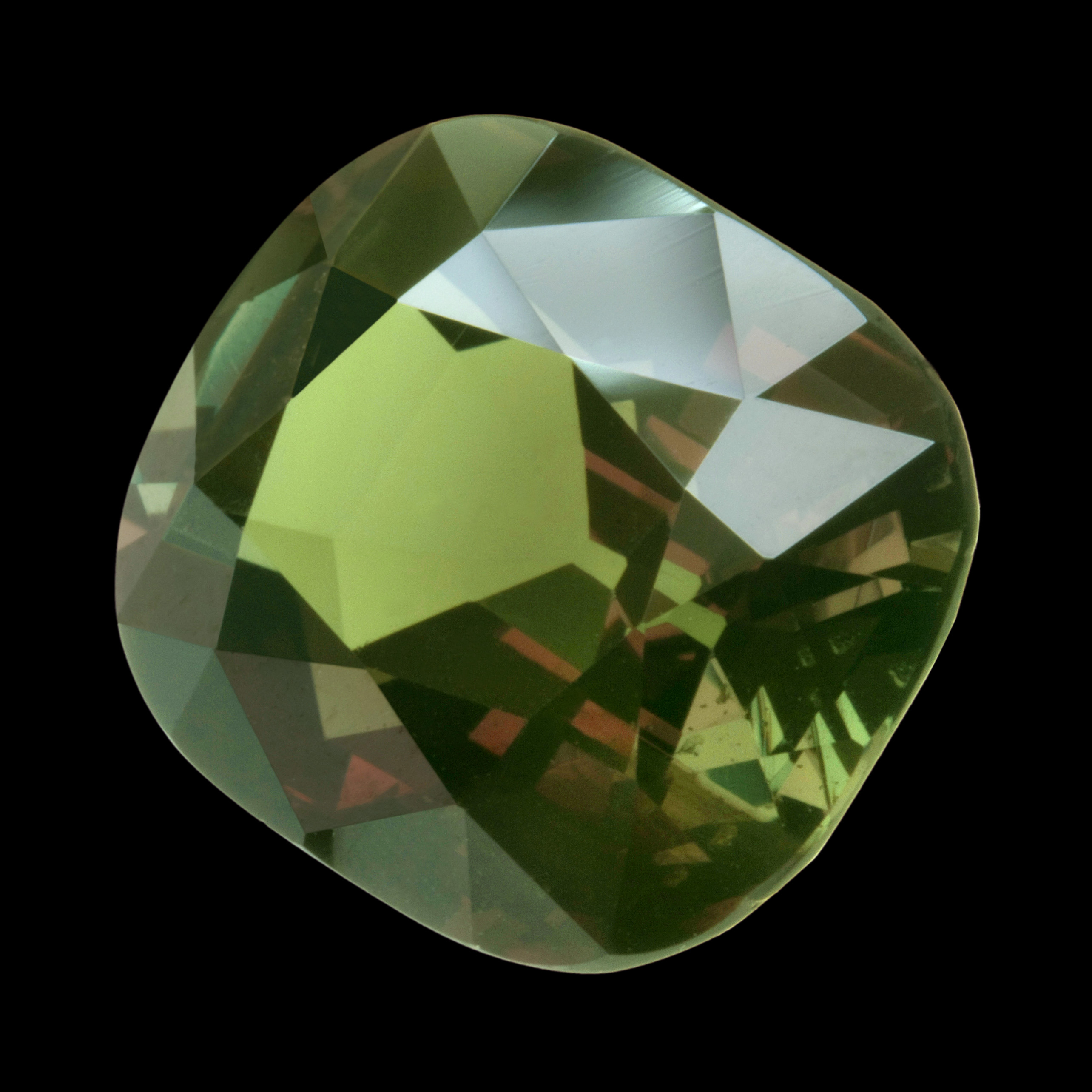 Faceted gem weighing 11.65 carats, a rare color changing variety of chrysoberyl called alexandrite. Shown here in green as seen in daylight. Stone is 14 mm in height.