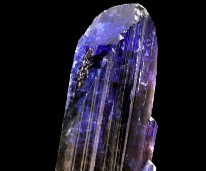 A natural crystal of tanzanite, bluish in color, weighing 1,263.8 carats and measuring 95 × 55 × 30 mm