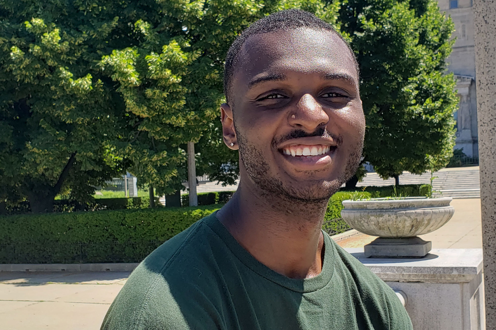 Levi Jenkins smiles for the camera outside the Field Museum.