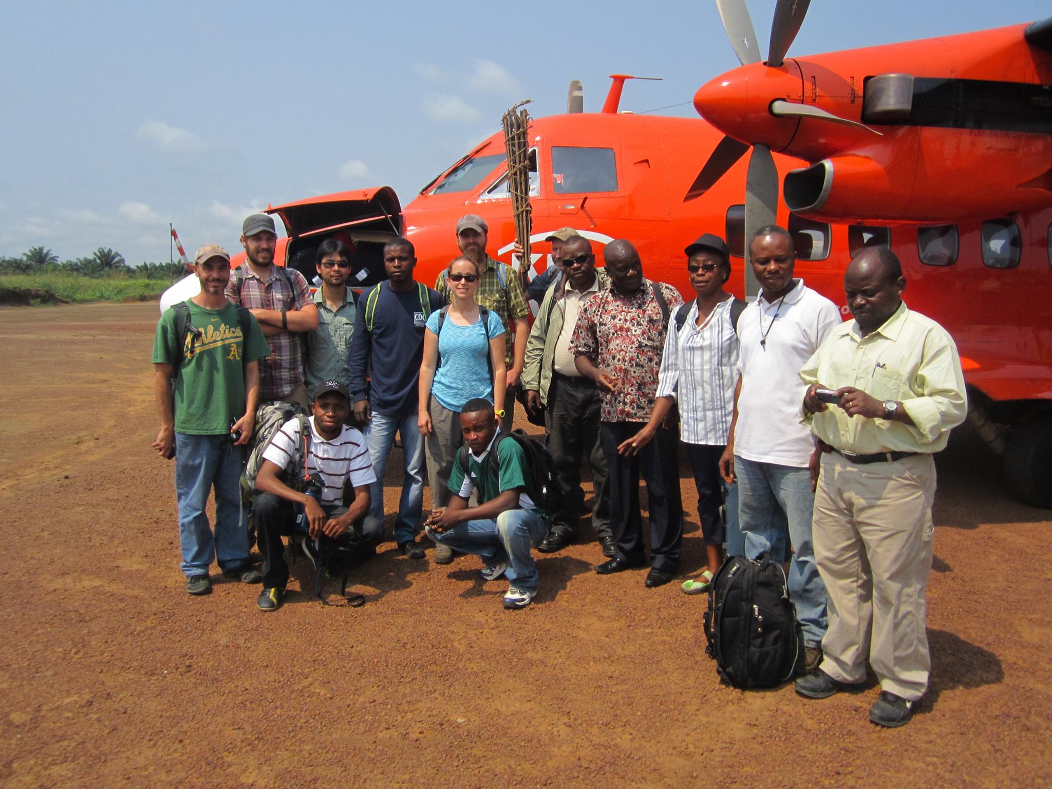 Bill and crew, during fieldwork in the Congo, 2013. That’s Bill in the back, holding a contrivance created for carrying a pangolin skin. Courtesy of the CDC.